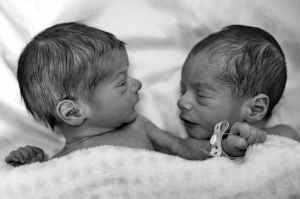 grayscale photography of two newborn