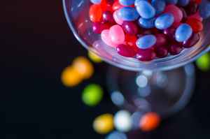 selective focus photography of jelly beans on jar