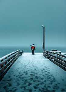 person standing on pier