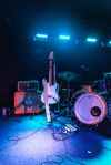photo of electric guitar and drum set