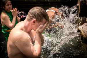 three person taking a bath