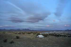 yurt in spacious valley in summer evening